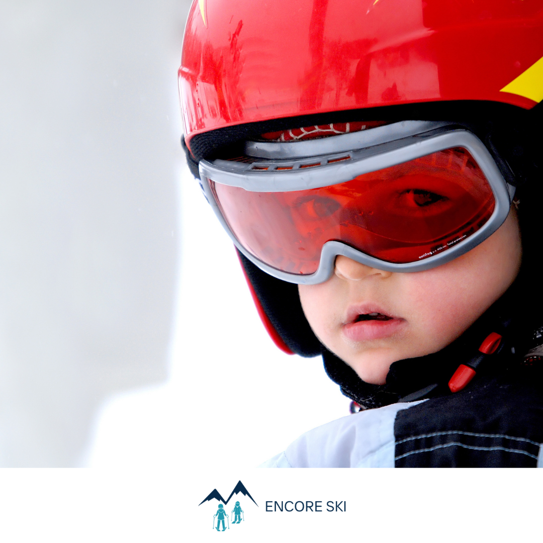 Young boy in ski helmet